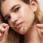 Charm placcato oro 18k con cristallo rosso.